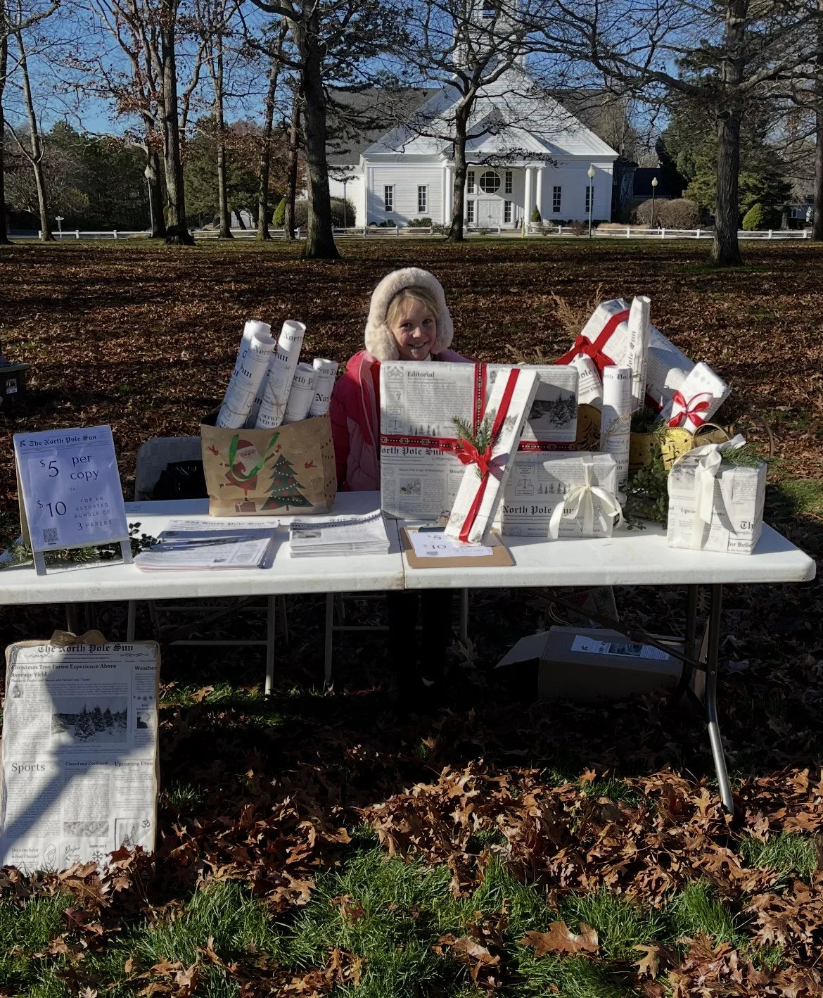 The North Pole Sun newspapers displayed at a market table